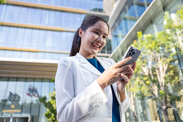 istock Businesswoman using voice command on smartphone 2250174859