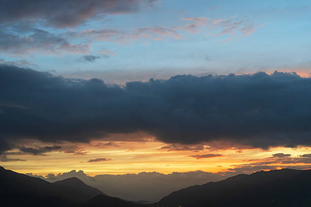 istock Bright sunset over the silhouette mountains at evening time. 2250176161