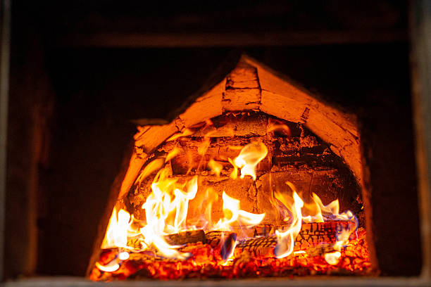 istock Traditional brick oven with burning firewood for baking bread 2250176391