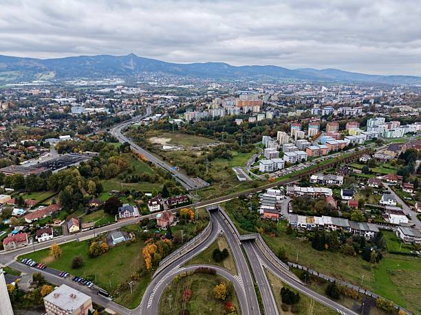istock Elevated Highway Exchanges Link Residential Zones With Distant City Expansions Beneath Somber Sky 2250176408