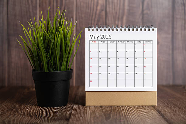istock May 2026 Desk Calendar On Wood Table 2250181497