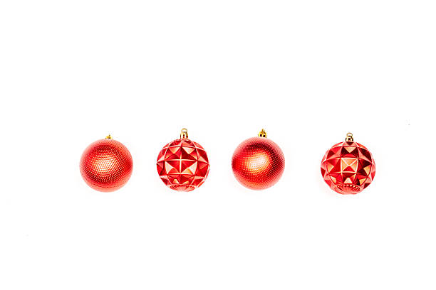 istock Row of Red Christmas Ornaments on White Background 2250184893