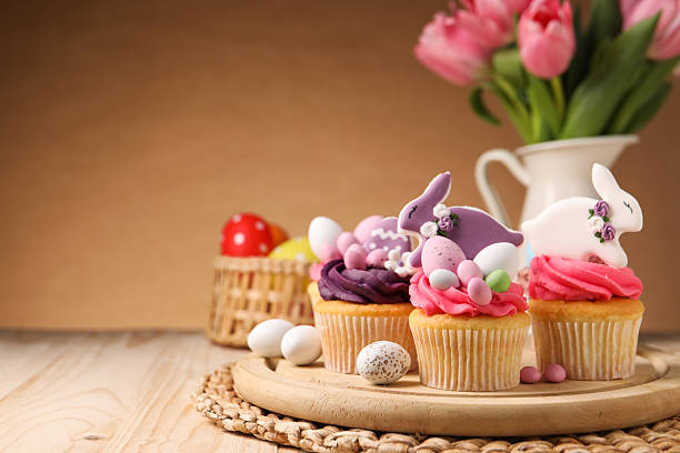 istock Tasty cupcakes with Easter decor on wooden table, space for text 2250188243