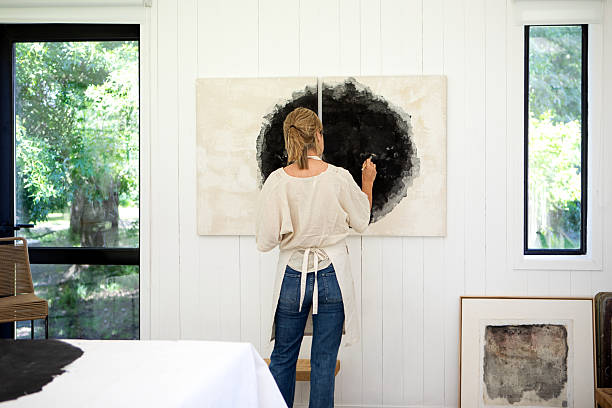 istock Mature female artist working in her studio 2250188832
