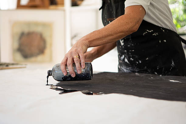 istock Mature female artist working in her studio 2250189199