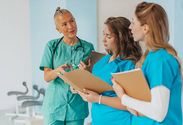 istock Medical workers discussing patient care in a hospital setting during work hours 2250193166