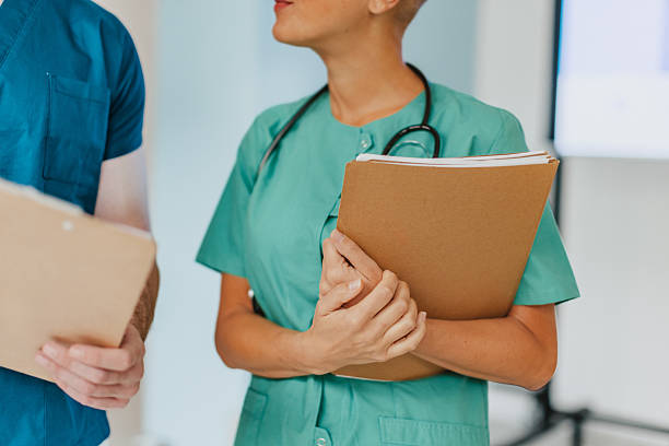 istock Medical workers discuss patient care in a hospital setting during a work shift in the afternoon 2250193844