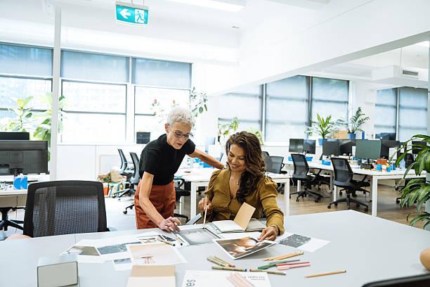istock Two mature creative entrepreneurs working in creative office with pottery and interior design solutions 2250195506
