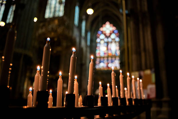istock Burning Prayer Candles in Dark Sacred Setting 2250198587