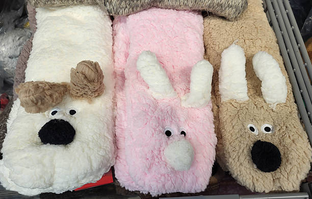 istock Colorful funny fluffy bunny-face socks on a store shelf. 2250200568