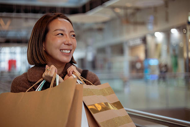istock Happy Woman Savoring Her Shopping Experience 2250203905