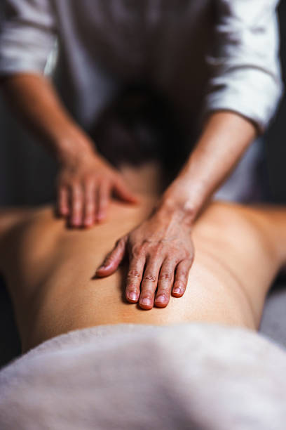 istock Relaxing Back Massage By Professional Therapist In Spa Setting For Pain Relief And Comfort 2250210943