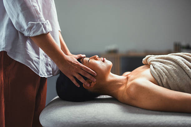 istock Relaxing Head Massage Scene With Therapist Providing Treatment On A Massage Table 2250211083