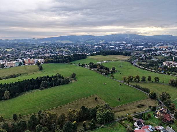 istock City Outskirts Landscape, Nightfall Over Sprawling Rural Fields With Scattered Trees And Distant Cityscape 2250217156