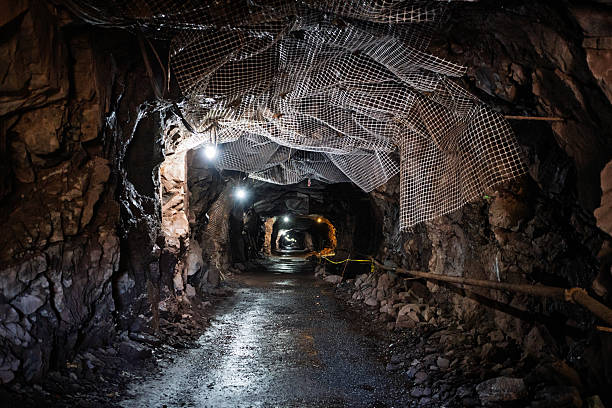 istock A dark tunnel with a light shining down on it 2250217294