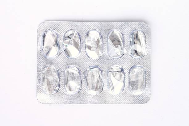 istock Empty silver aluminum foil and plastic blister pack with ten used cavities, representing finished medication, isolated on a clean white background in a studio shot 2250223803
