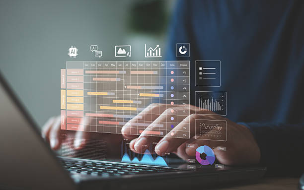 istock Businessman using laptop with digital project management dashboard featuring timeline, AI icon, chart and progress data, symbolizing workflow optimization, analytic and modern productivity tool. 2250226083