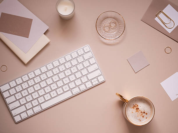A feminine workspace image with a calm beige background