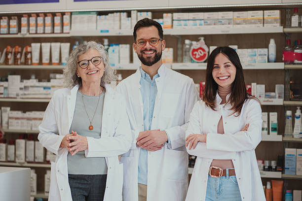 istock Pharmacy team smiling in modern drugstore 2250234606