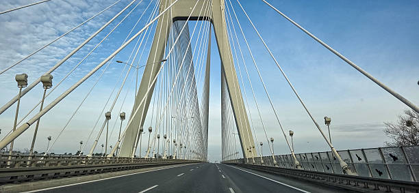 istock Suspension bridge over the road. Modern structures on the highway 2250246551