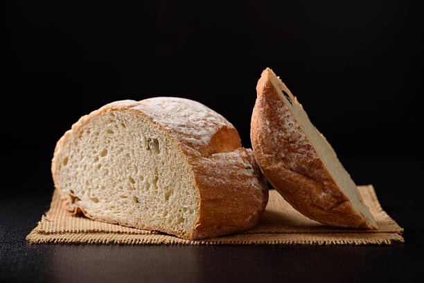 istock Freshly baked sourdough bread   on a black background 2250248168