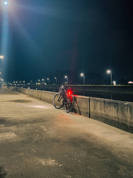 istock Bicycle Parked on the Sidewalk at Night 2250248888