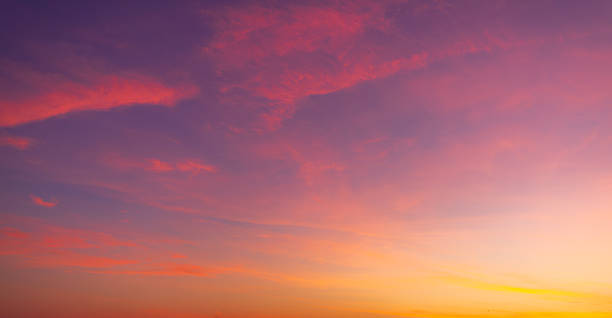 istock Colorful clouds and sky backdrop during twilight,sky and clouds during sunset time background,Twilight sky with crescent moon, soft pink clouds, and gradient colors during peaceful sunset. 2250253727