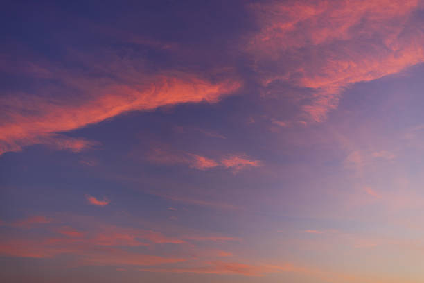 istock Colorful clouds and sky backdrop during twilight,sky and clouds during sunset time background,Twilight sky with crescent moon, soft pink clouds, and gradient colors during peaceful sunset. 2250253756