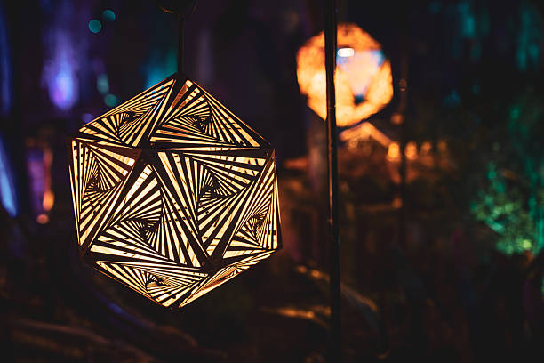 This decorative lantern features a mesmerizing geometric pattern, creating a captivating visual effect in low light