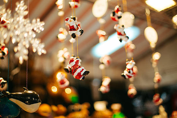 Christmas tree and Santa Clause decoration ornament  in Christmas market during December in Piazza Santa Croce, Florence, Italy