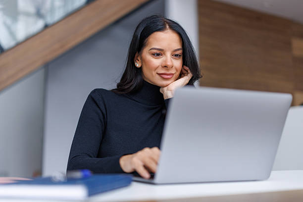 istock Businesswoman working on laptop in modern office 2250265697