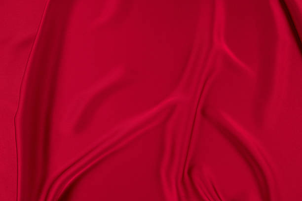 istock Red Festive Crumpled Silk Texture Background 2250267644