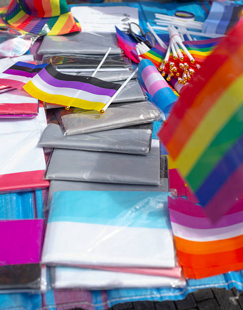 istock table adorned with various rainbow and identity flags illustrating inclusion and community spirit 2250276014
