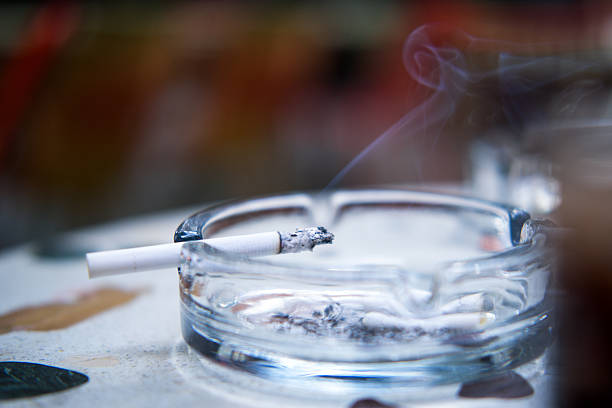 istock Close-up of a burning cigarette in an ashtray. 2250277028