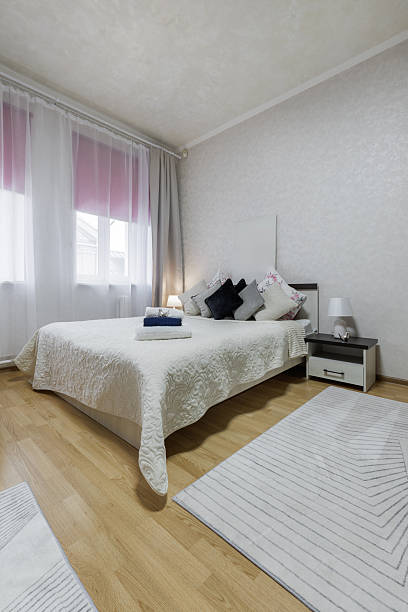 istock Bright Bedroom Interior with Soft Textiles and Neutral Cozy Decor 2250278695