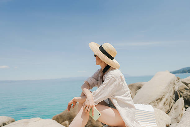 istock Soaking up the sun on the local beach 2250281179