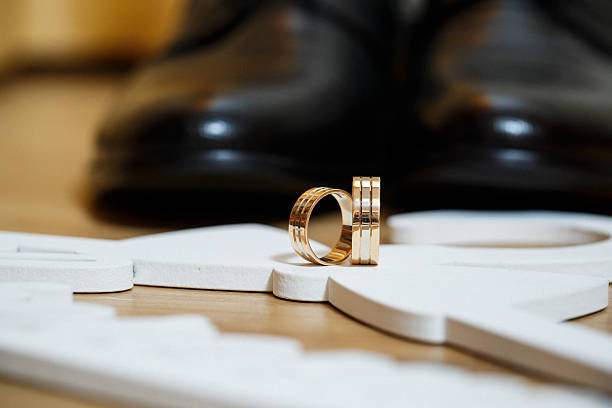 istock Golden wedding rings for newlyweds 2250282128