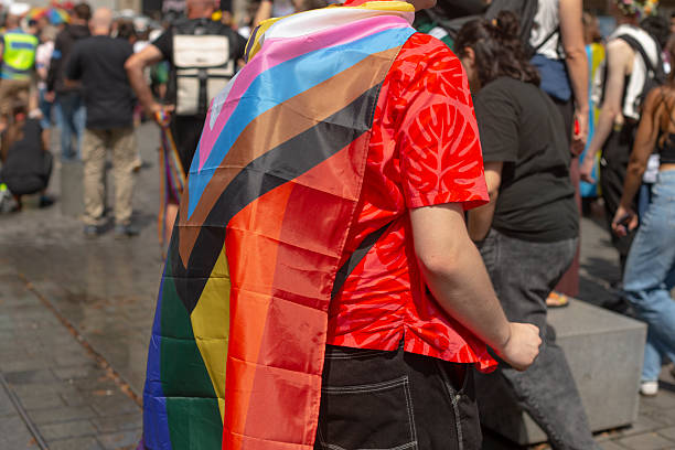 istock marching with purpose, person with vibrant attire moves confidently during public rights demonstration 2250282925