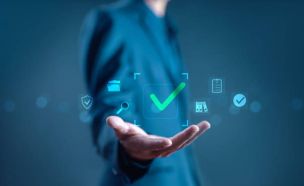 istock green check mark over a laptop, checklist review, verification process, symbolizing verification, approval, and digital document review. check of document, list survey, form business 2250283027