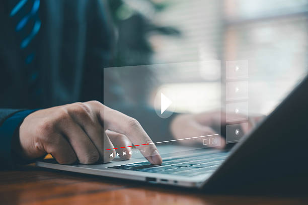 istock businessman using a laptop, video music player interface, concept of digital content creation, online media streaming, virtual webinar education on a live platform, multimedia technology business 2250283120