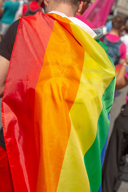 istock rainbow banner amid bustling crowd, celebratory parade with vivid hues and enthusiastic supporters 2250284841