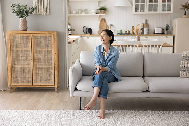 istock Untroubled mature female spend pastime alone at home 2250288294