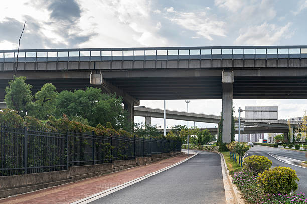 istock Concrete structure and asphalt road space under the overpass in the city 2250293618