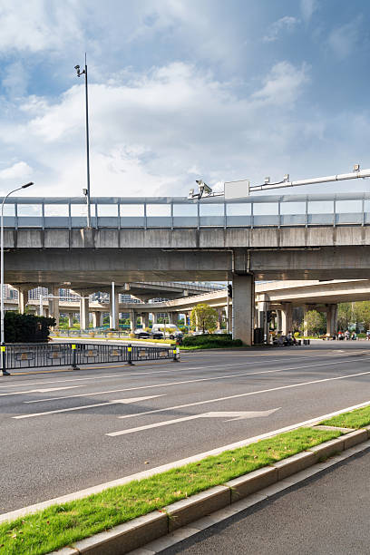 istock Concrete structure and asphalt road space under the overpass in the city 2250293631