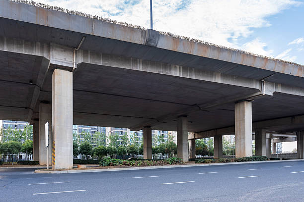 istock Concrete structure and asphalt road space under the overpass in the city 2250300950
