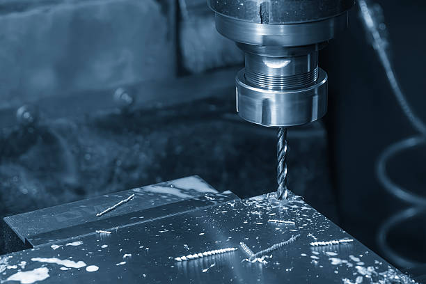 istock The hole chamfering process on NC milling machine with drill tools in the light blue scene.  The metal working concept on the milling machine. 2250303864