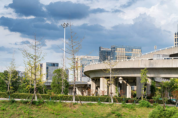 istock Concrete structure and asphalt road space under the overpass in the city 2250304352