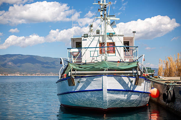 A white fisherman boat in the sea in Agia Roumeli