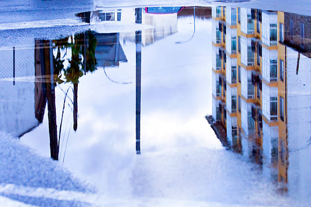 Wet street  floor,  puddle and reflections, image suitable for background purposes. Townscape, Galicia, Spain.