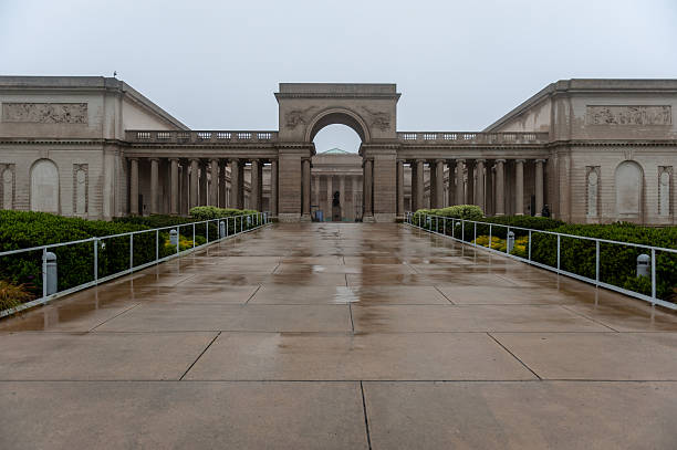 Washington, D.C., USA - December 14, 2025: Two statues appear vigilant atop the main entrance to Washington Union Station as unseen passengers enter beneath.